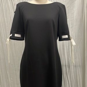 Calvin Klein Elegant Black Dress with White Bow Trim on Sleeves. Size 6